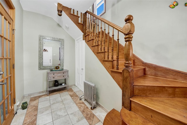 820 S Oak Dr, Bronx, NY 10467 - staircase with radiator heating unit, tile patterned flooring, and baseboards