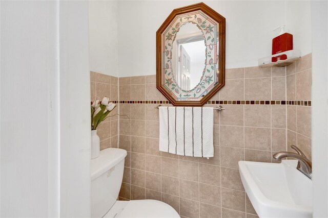 820 S Oak Dr, Bronx, NY 10467 - bathroom with tile walls, a sink, and toilet