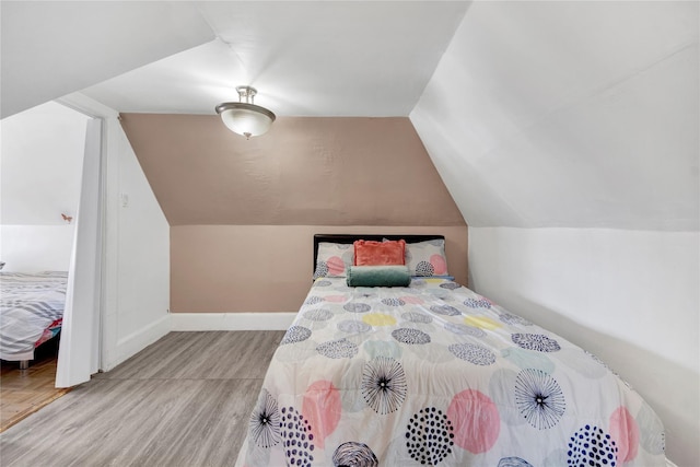820 S Oak Dr, Bronx, NY 10467 - bedroom featuring baseboards and vaulted ceiling