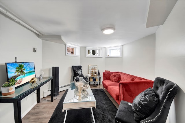 820 S Oak Dr, Bronx, NY 10467 - living area featuring baseboard heating, a baseboard heating unit, and wood finished floors