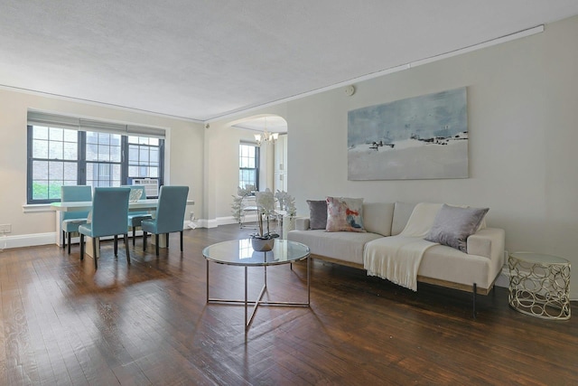 1273 N Ave Unit 1Ab, New Rochelle, NY 10804 - living room with wood-type flooring, crown molding, arched walkways, a chandelier, and baseboards