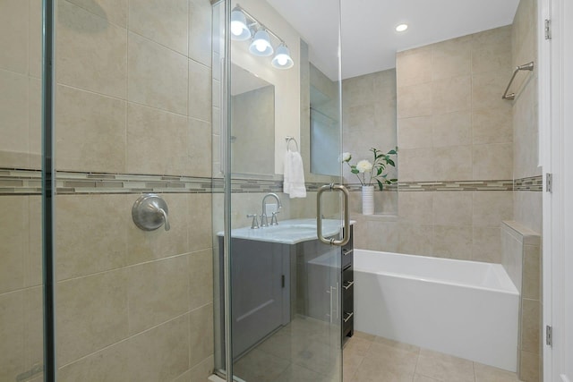 1273 N Ave Unit 1Ab, New Rochelle, NY 10804 - full bathroom with tile walls, tile patterned flooring, a stall shower, a bath, and vanity