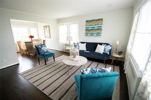 living room featuring baseboards and wood finished floors