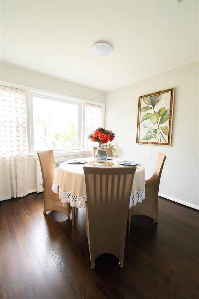 dining area with wood finished floors
