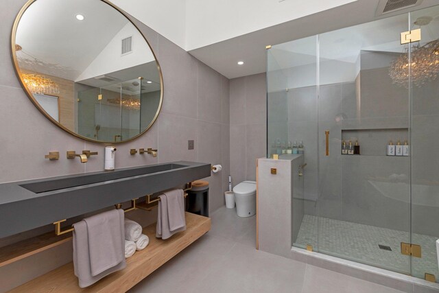 1166 Hastings Cir, Baldwin Harbor, NY 11510 - bathroom with tile walls, a shower stall, tile patterned floors, recessed lighting, and vanity