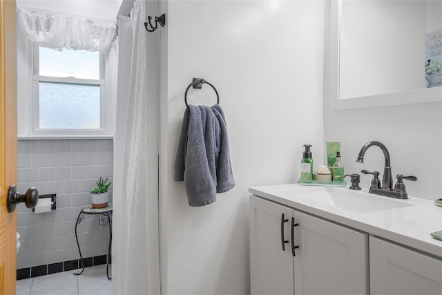 bathroom featuring vanity, tile walls, and tile patterned flooring