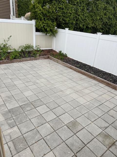 1 E Saltaire Rd, Lindenhurst, NY 11757 - view of patio / terrace featuring a fenced backyard