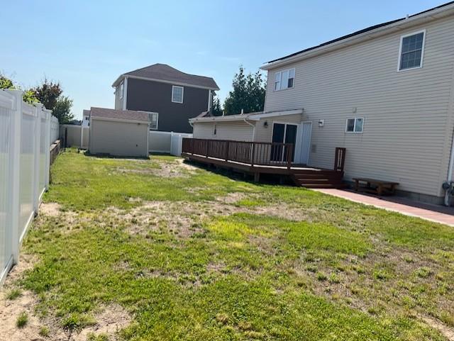 1 E Saltaire Rd, Lindenhurst, NY 11757 - view of yard featuring a deck