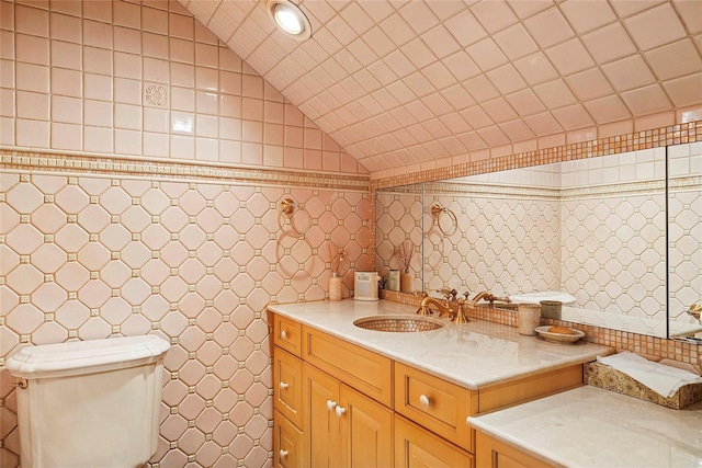 104 Grosvenor, Douglaston, NY 11363 - bathroom featuring toilet, tile walls, vanity, and lofted ceiling
