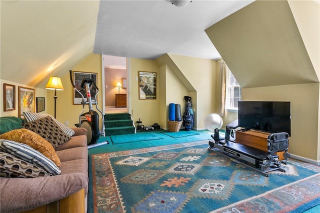 carpeted living room featuring baseboards and vaulted ceiling