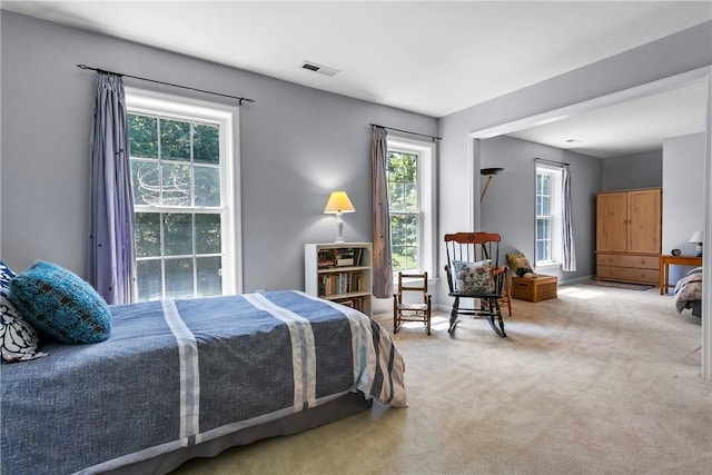 bedroom featuring carpet and visible vents