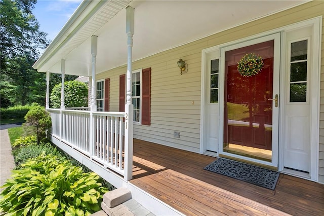 view of exterior entry with a porch