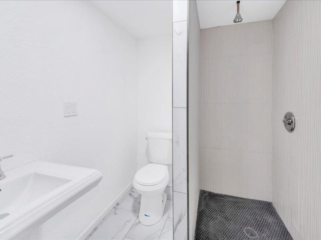 166 Sears Ave, Elmsford, NY 10523 - full bath featuring marble look tile flooring, a stall shower, toilet, and a sink