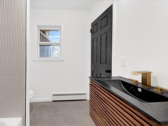 166 Sears Ave, Elmsford, NY 10523 - full bath featuring baseboard heating, tile patterned flooring, toilet, vanity, and baseboards