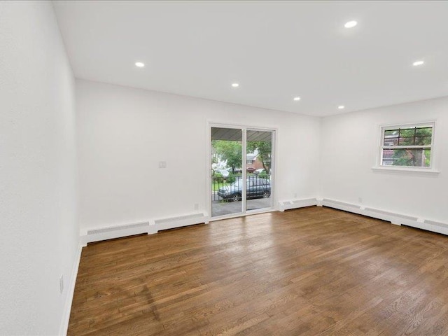 166 Sears Ave, Elmsford, NY 10523 - empty room featuring wood finished floors, recessed lighting, a baseboard radiator, and baseboards