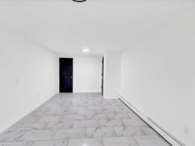 166 Sears Ave, Elmsford, NY 10523 - spare room with a baseboard heating unit, light marble finish flooring, and baseboards