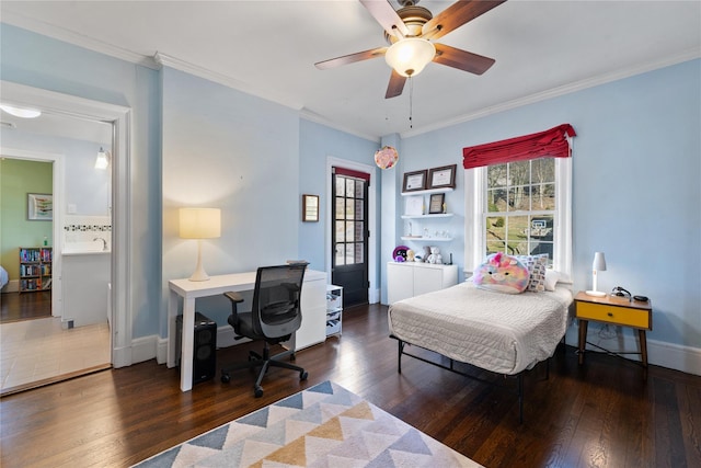 bedroom with crown molding, baseboards, a ceiling fan, and hardwood / wood-style floors