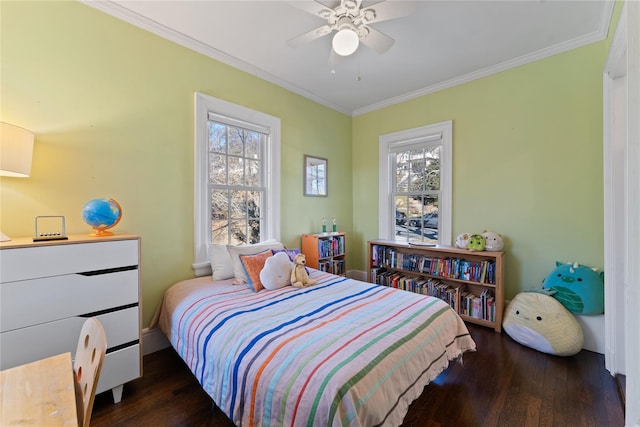 bedroom with multiple windows, wood-type flooring, a ceiling fan, and ornamental molding