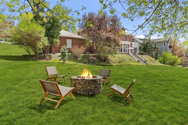 view of yard with an outdoor fire pit