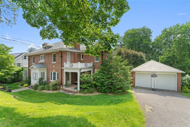 27 Calumet Ave, Hastings-On-Hudson, NY 10706 - view of front of property with brick siding, a garage, an outbuilding, a front yard, and a chimney