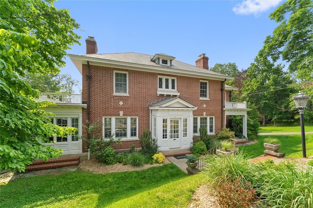 27 Calumet Ave, Hastings-On-Hudson, NY 10706 - back of house with a chimney, a balcony, a yard, and brick siding