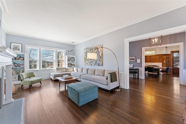 27 Calumet Ave, Hastings-On-Hudson, NY 10706 - living area featuring dark wood-style flooring, a fireplace, a chandelier, and ornamental molding