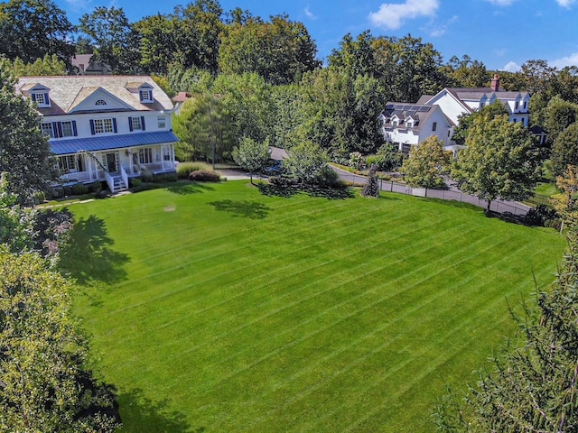 5 Briarcliff Rd, Chappaqua, NY 10514 - view of green lawn featuring covered porch and view of scattered trees