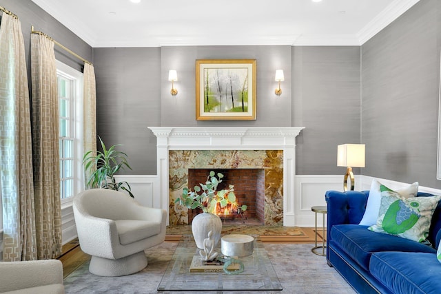 5 Briarcliff Rd, Chappaqua, NY 10514 - living room featuring wood finished floors, ornamental molding, a wainscoted wall, a fireplace, and a decorative wall