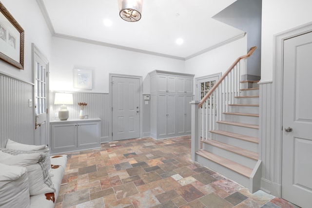 5 Briarcliff Rd, Chappaqua, NY 10514 - entryway featuring stairway, stone tile floors, ornamental molding, and a wainscoted wall