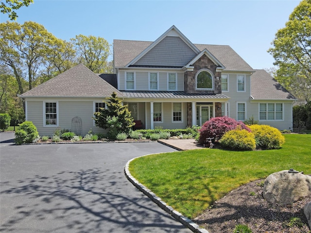 103 Silver Beech Ln, Calverton, NY 11933 - view of front facade with a shingled roof and a front lawn