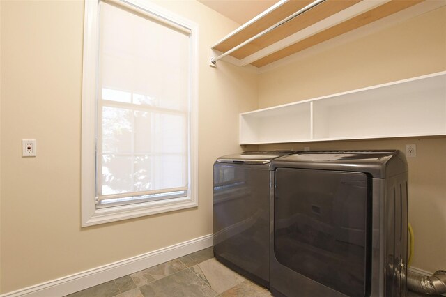 103 Silver Beech Ln, Calverton, NY 11933 - clothes washing area with independent washer and dryer, laundry area, and baseboards