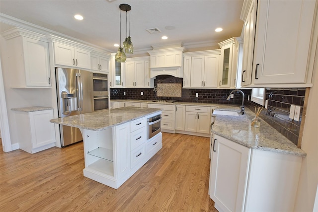 103 Silver Beech Ln, Calverton, NY 11933 - kitchen with white cabinets, visible vents, stainless steel appliances, a sink, and open shelves