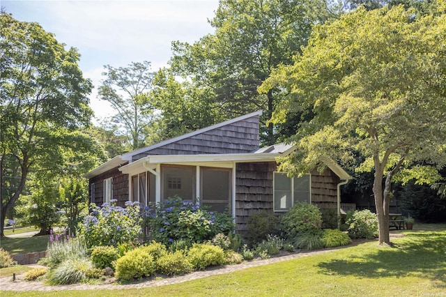 2955 Hyatt Rd, Southold, NY 11971 - view of side of home with a lawn