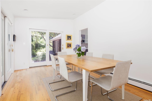 2955 Hyatt Rd, Southold, NY 11971 - dining room with a baseboard radiator and light wood-type flooring