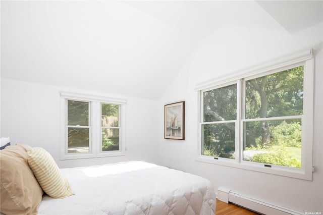 2955 Hyatt Rd, Southold, NY 11971 - bedroom featuring a baseboard radiator and vaulted ceiling