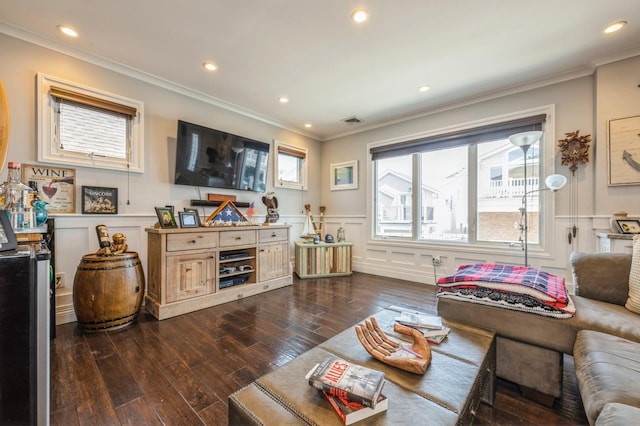 93 Nebraska St, Long Beach, NY 11561 - living area with ornamental molding, a wainscoted wall, dark wood-style floors, a decorative wall, and recessed lighting
