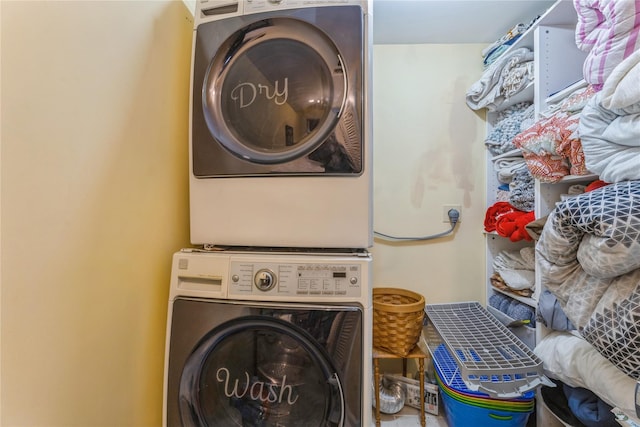 washroom with laundry area and stacked washer and clothes dryer