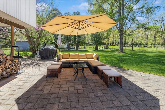 view of patio / terrace featuring grilling area, outdoor lounge area, and a fenced backyard