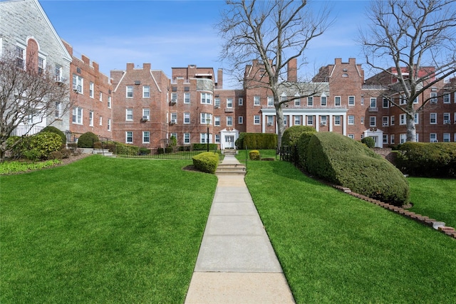 view of community featuring a lawn