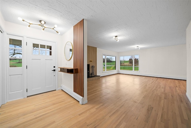 139 Cross Rd, Goshen, NY 10924 - foyer with baseboards, light wood-type flooring, and a baseboard heating unit