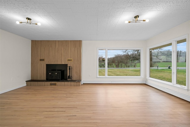 139 Cross Rd, Goshen, NY 10924 - unfurnished living room with visible vents, light wood-type flooring, and baseboards