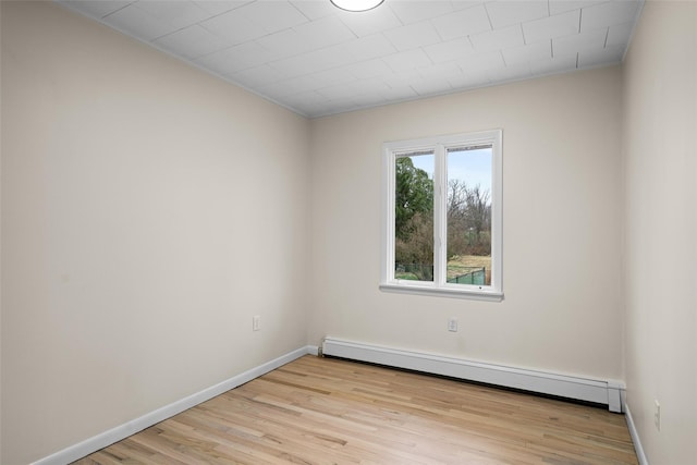 139 Cross Rd, Goshen, NY 10924 - empty room featuring baseboard heating, baseboards, and light wood-style flooring