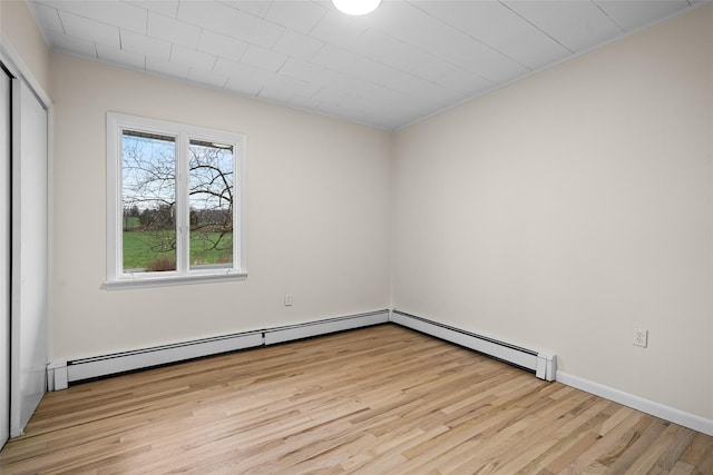 139 Cross Rd, Goshen, NY 10924 - empty room with a baseboard radiator and light wood finished floors