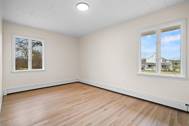 139 Cross Rd, Goshen, NY 10924 - empty room with baseboard heating and wood finished floors