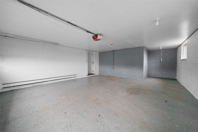 139 Cross Rd, Goshen, NY 10924 - garage with concrete block wall, a garage door opener, and baseboard heating