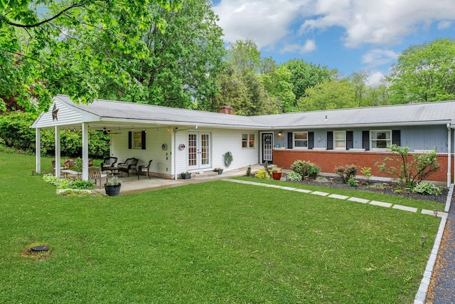 25 Macgregor Dr, Mahopac, NY 10541 - back of house featuring a yard, french doors, brick siding, a chimney, and a patio