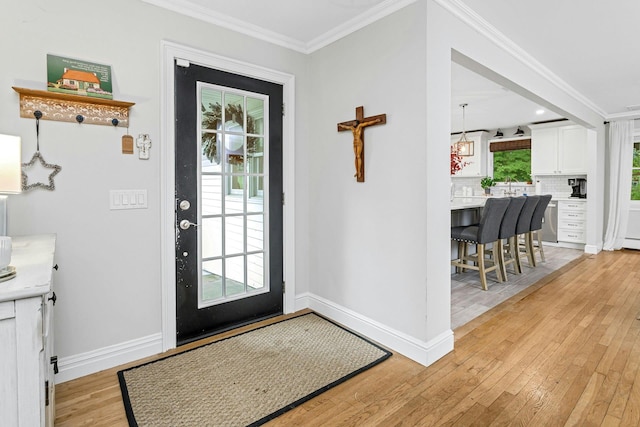 25 Macgregor Dr, Mahopac, NY 10541 - entryway with light wood finished floors, ornamental molding, and baseboards