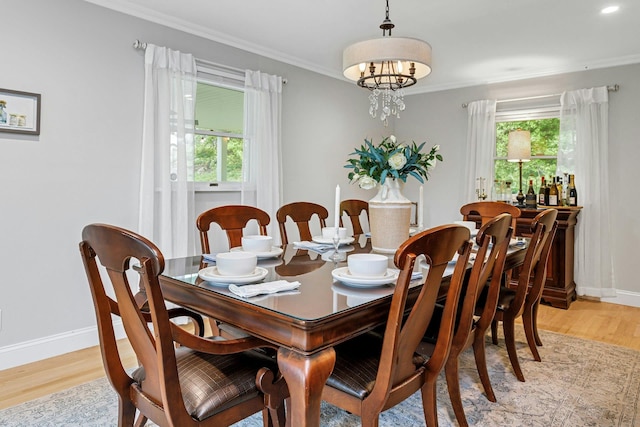 25 Macgregor Dr, Mahopac, NY 10541 - dining room featuring healthy amount of natural light, light wood-style floors, baseboards, and crown molding