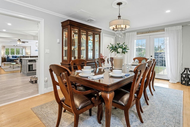 25 Macgregor Dr, Mahopac, NY 10541 - dining area with french doors, crown molding, light wood-style floors, recessed lighting, and baseboards
