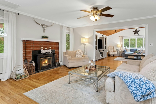 25 Macgregor Dr, Mahopac, NY 10541 - living area with wood finished floors, ornamental molding, a ceiling fan, a tile fireplace, and baseboard heating
